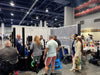 The picture of the ASD, the Brand FOL speaker is showing their product to their audience and customers