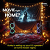 Romantic home movie night setup with FOL speakers, cozy lighting and projected screen.