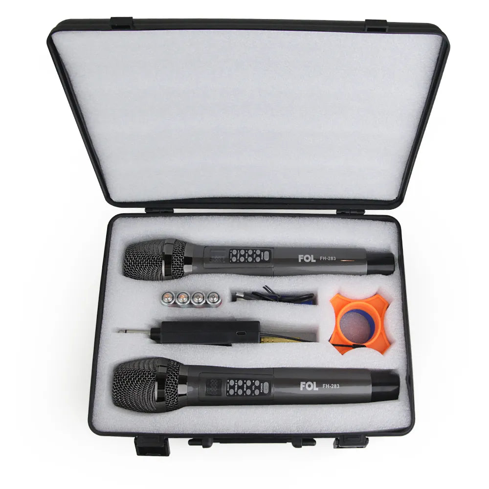 An open storage case containing two black FOL FH-283 wireless microphones, along with accessories and colored filters.